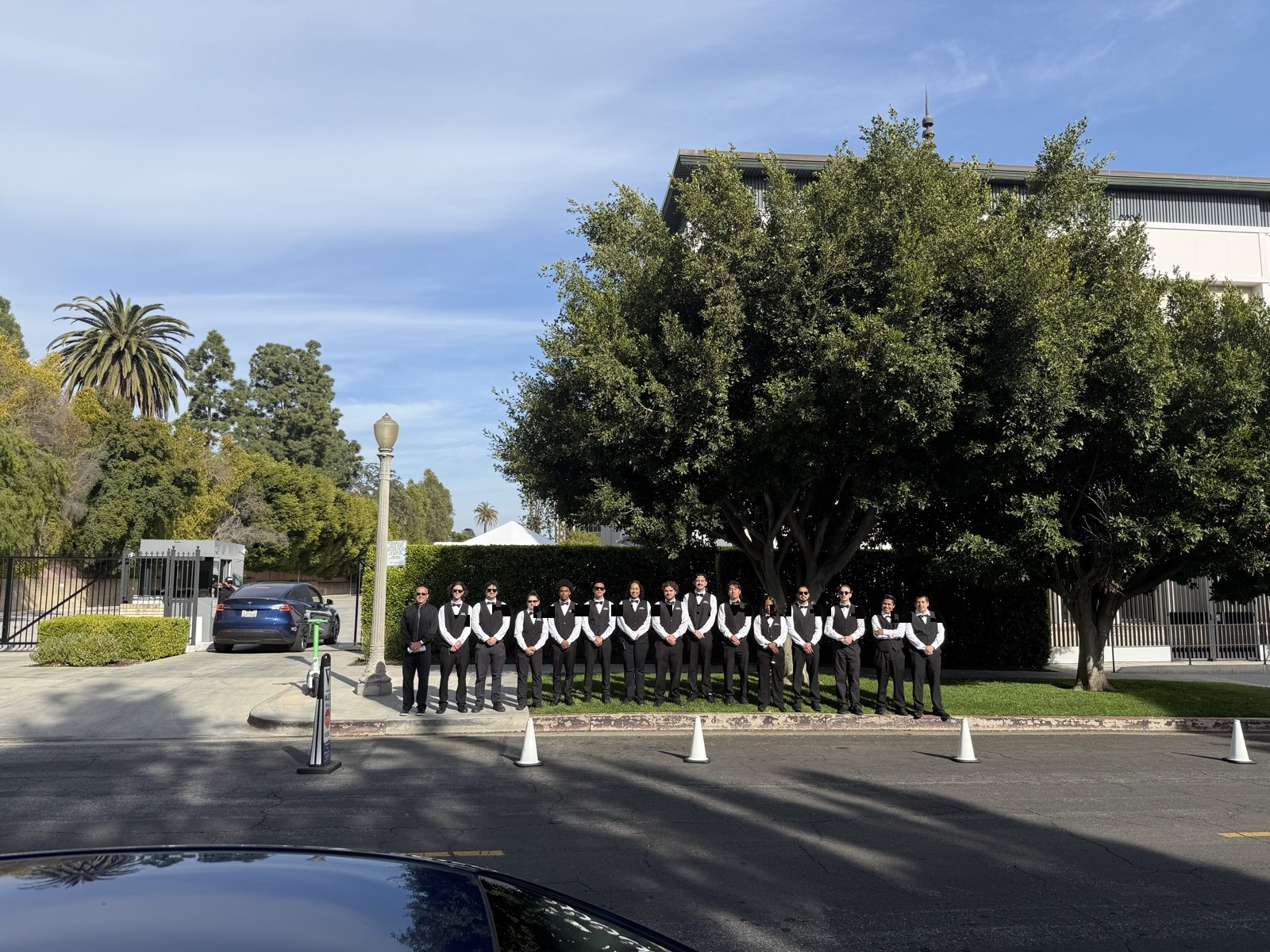 Valet attendants staged with cones for an organized event arrival